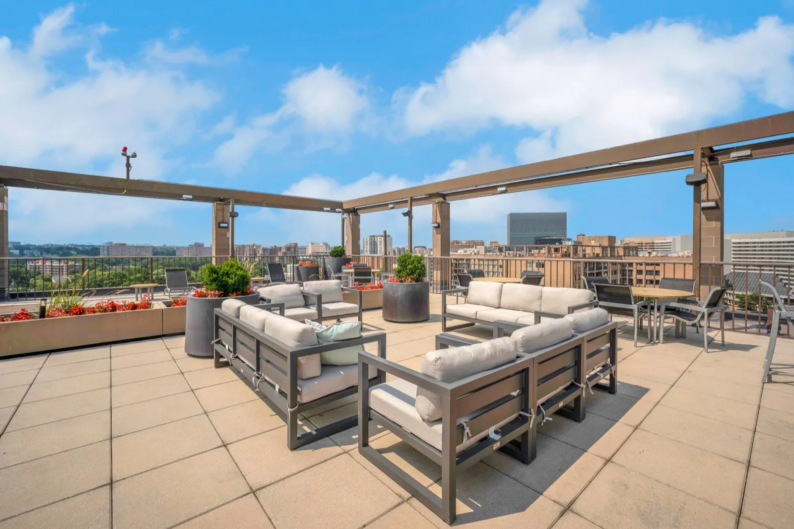 Living area with a panoramic window and city skyline view in Crystal City corporate housing